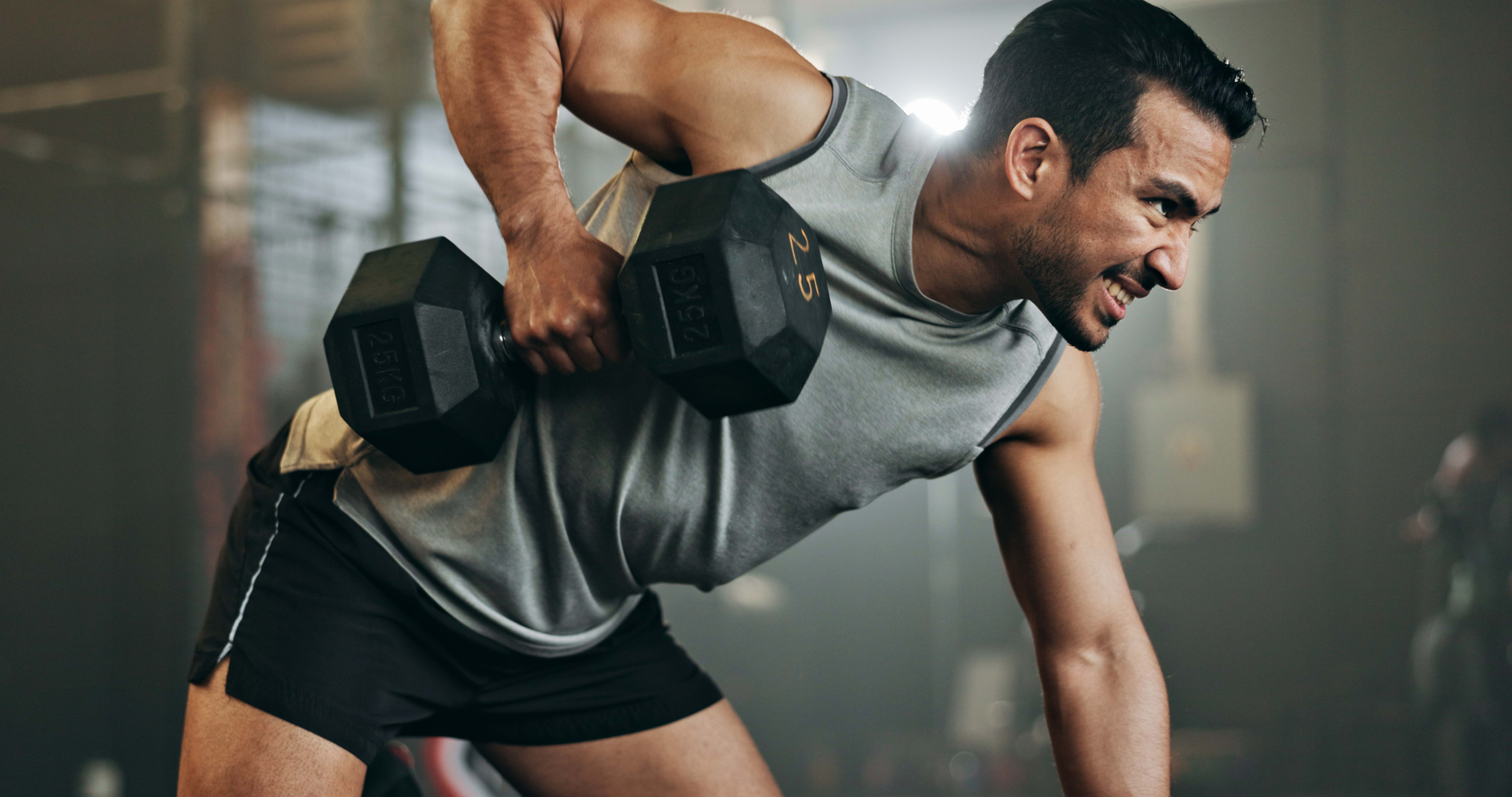 man-dumbbell-and-weightlifting-in-fitness-workout-or-arm-exercise-on-bench-at-indoor-gym.-serious-male-person-bodybuilder-or-athlete-lifting-weight-in-sports-training-health-and-wellness-at-club.jpg